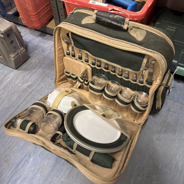 Vintage picnic hamper satchel with dining set contents.