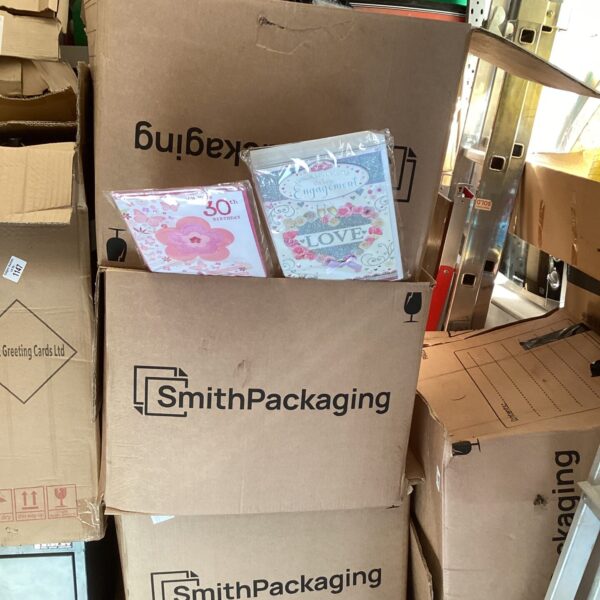 Mixed lot of three boxes filled with assorted greeting cards for various occasions.