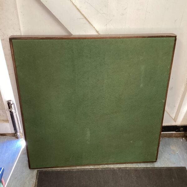 Vintage green folding card table with felt surface.