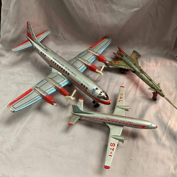 Vintage tin plate aircraft lot of three colourful planes.