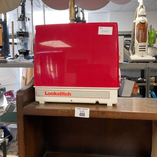 Red vintage Singer Lockstitch childrens sewing machine.