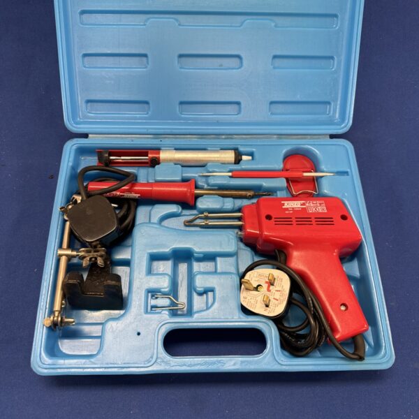 Open Kinzo soldering iron set with tools inside case.