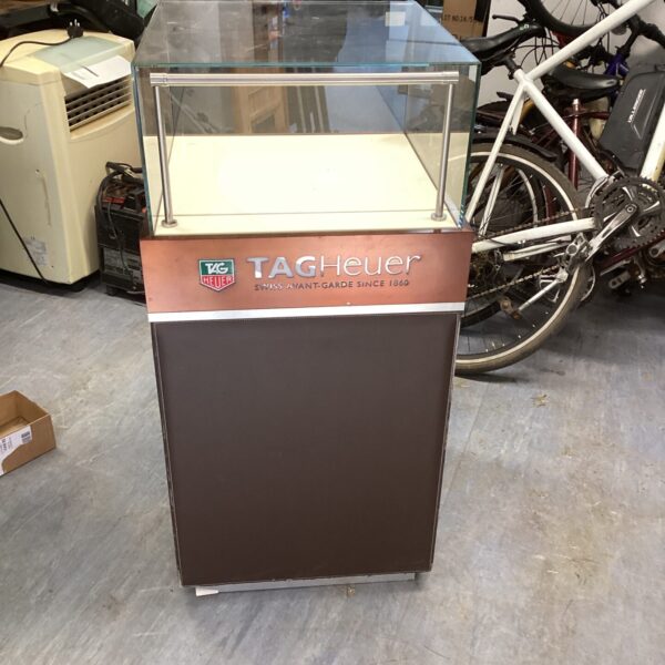 Front view of a Tag Heuer branded watch display case.