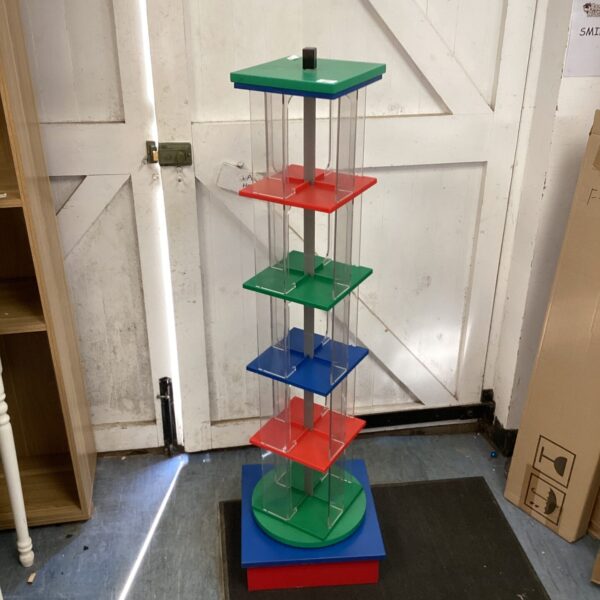 Colourful revolving acrylic display unit for shop or home.
