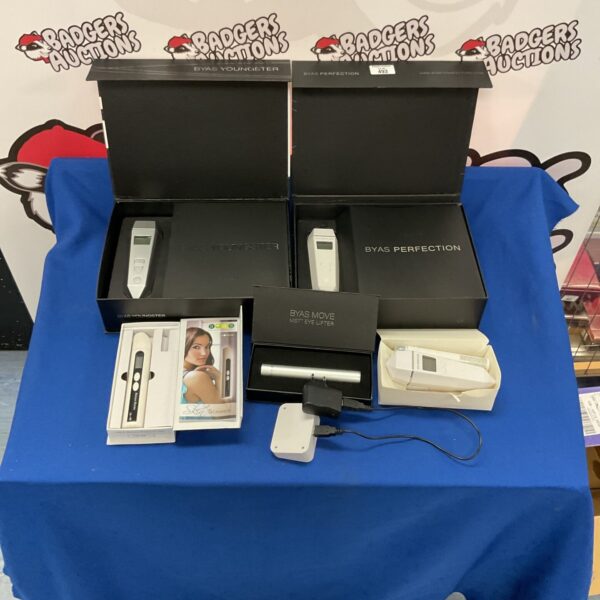 Byas beauty device lot including skin moisture monitor and lifters.