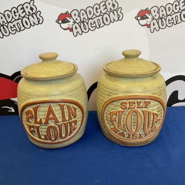 Pair of vintage stoneware flour jars with lids.