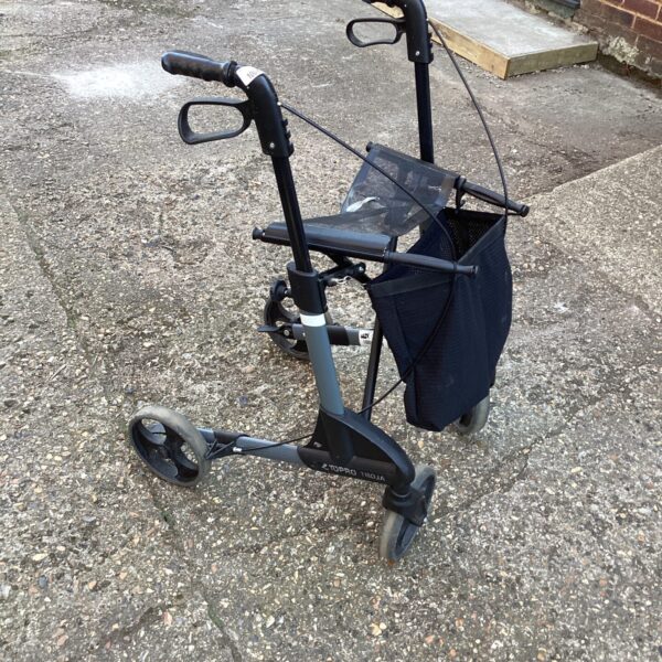 Front view of a three-wheeled walking aid trolley.