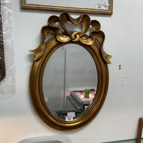 Elegant French style gilt mirror with bevelled edge.