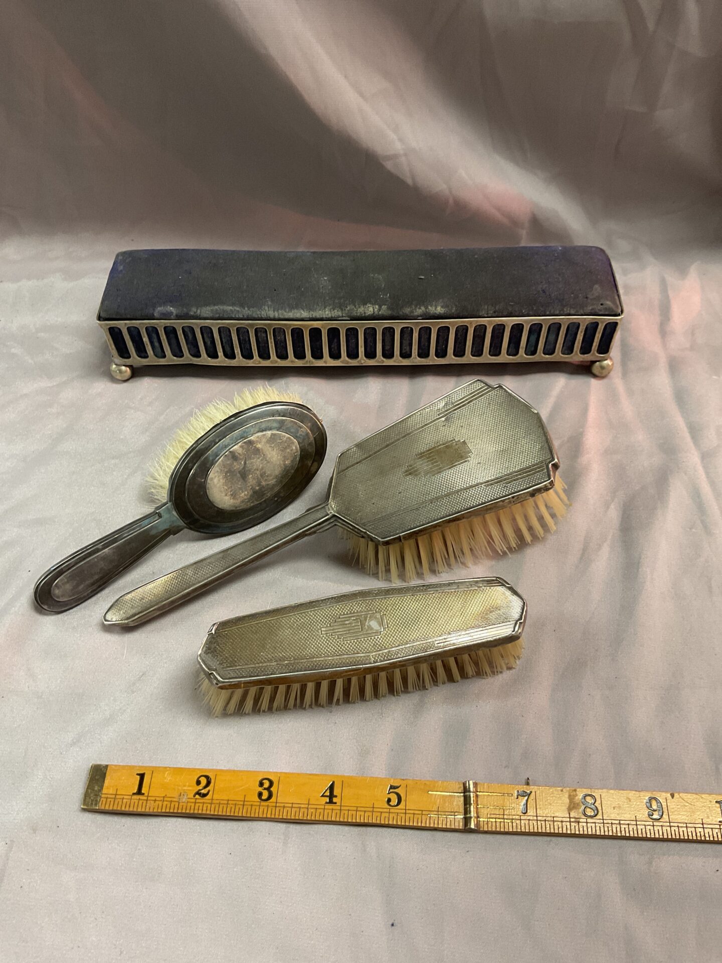 922 Three silver backed brushes and Silverplate hat Pin box