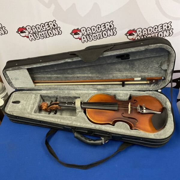 Gastor violin in case with bow, a classic string instrument.