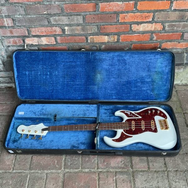 Vintage Burns bass guitar in hard case, 1960s British instrument.