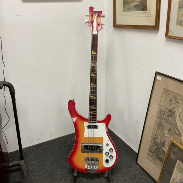 Vintage Rickenbacker bass guitar with sunburst finish.