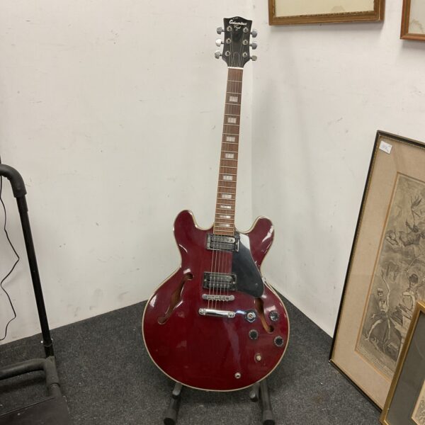 Vintage Columbus electric guitar with sunburst finish.