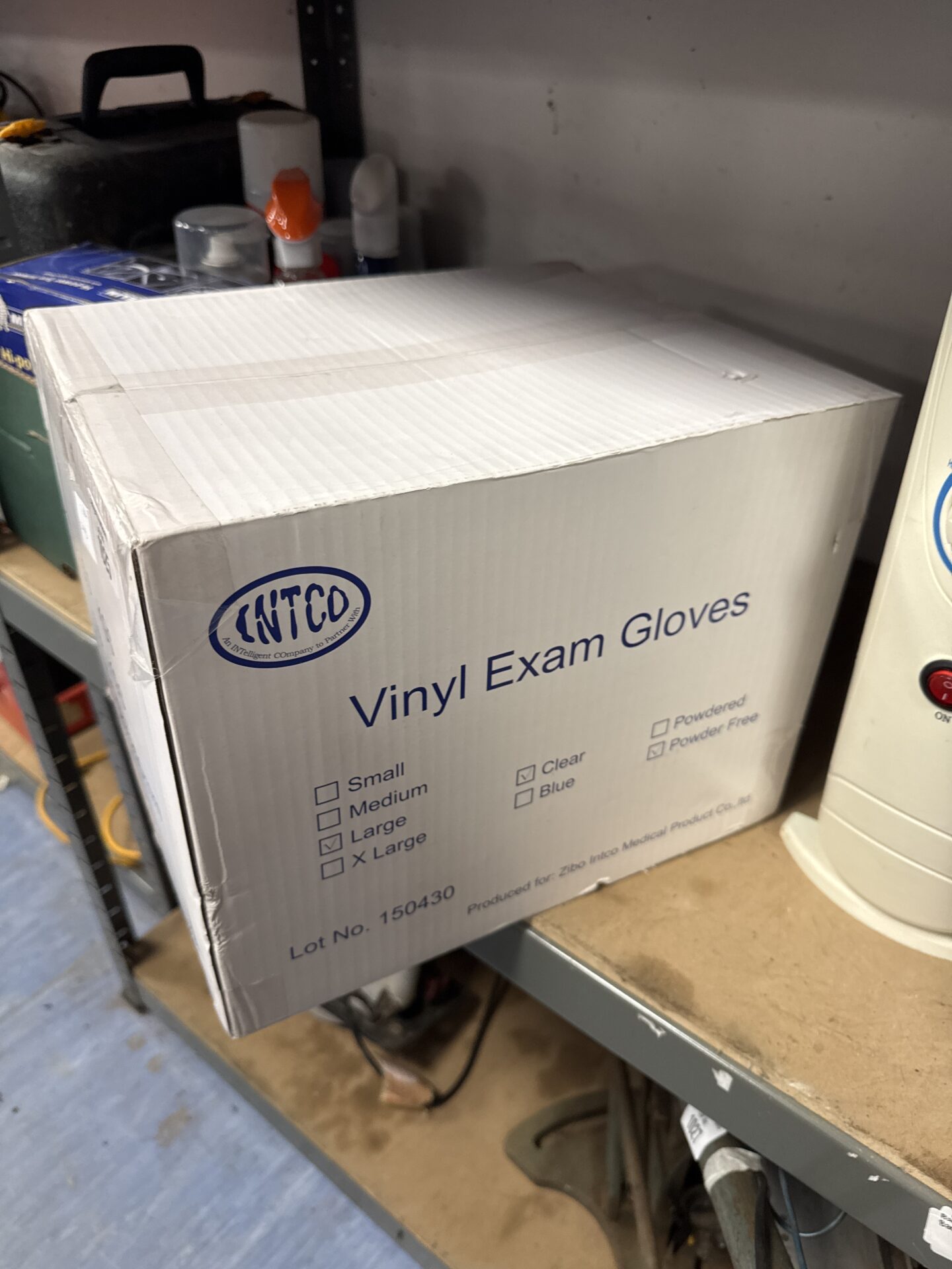 1025 Sealed box of intco vinyl exam gloves size L