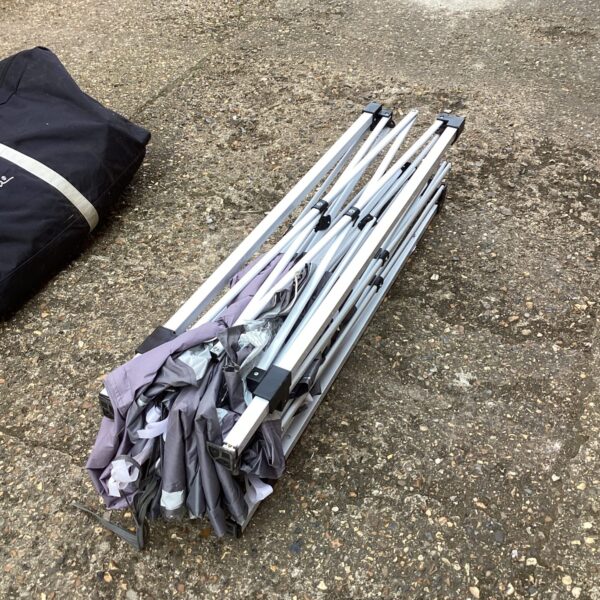 Silver telescopic gazebo frame for outdoor shelter.