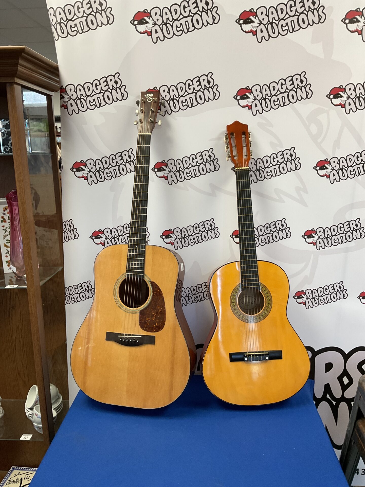 776 Two acoustic guitars inc herald & santa cruz (damaged in back)