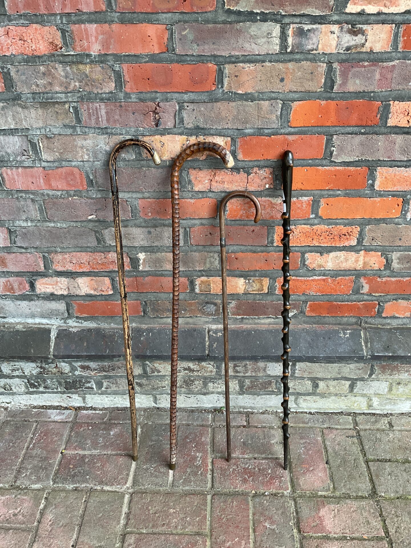 786 Four vintage walking canes including one with silver cuff