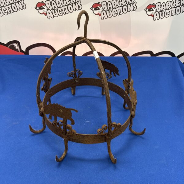 Vintage wrought iron hanging bracket for plants and baskets.