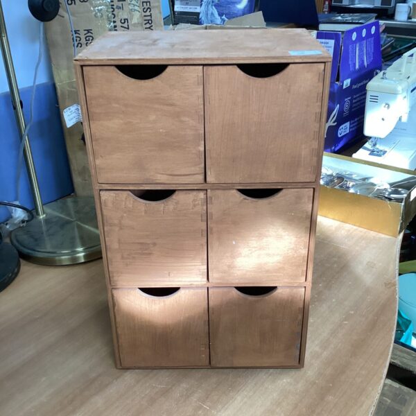 Front view of a wooden six-drawer storage unit.