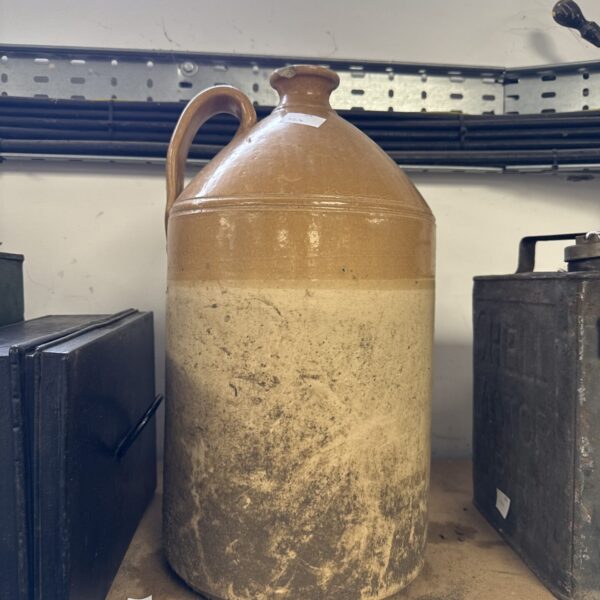 Large antique salt glazed flagon with brown glaze.