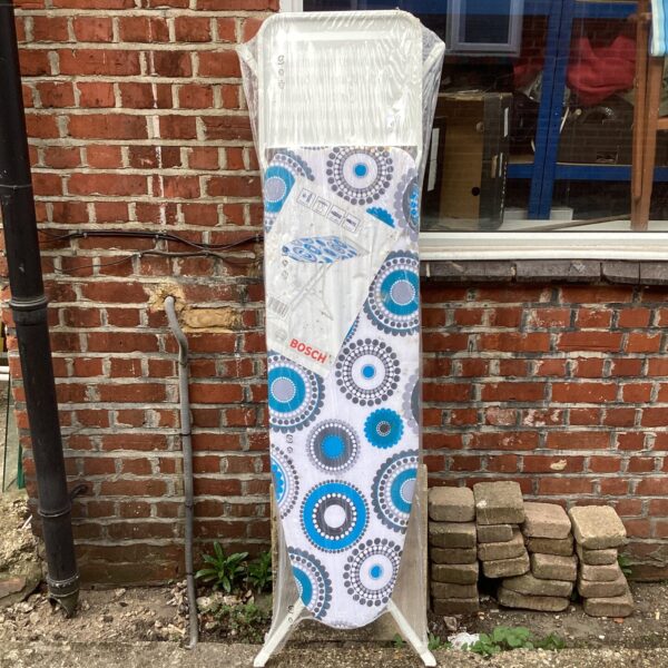 Patterned Bosch ironing board for laundry and clothes pressing.