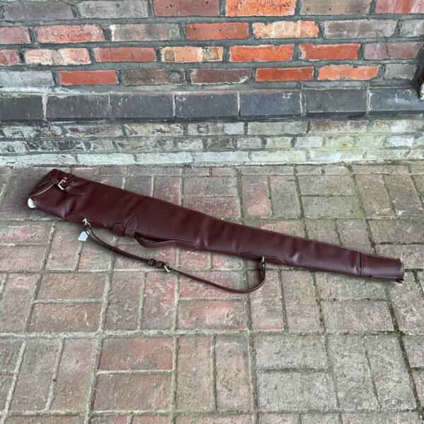 Vintage brown leather rifle case with wool lining.