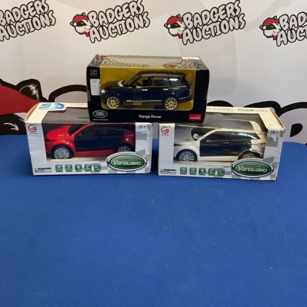 Boxed diecast model cars including a Range Rover.