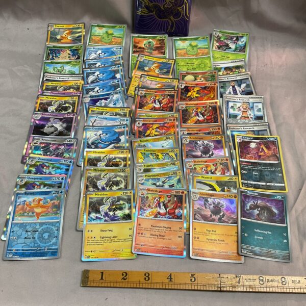 Assorted Pokemon cards and card sleeves for collectors.
