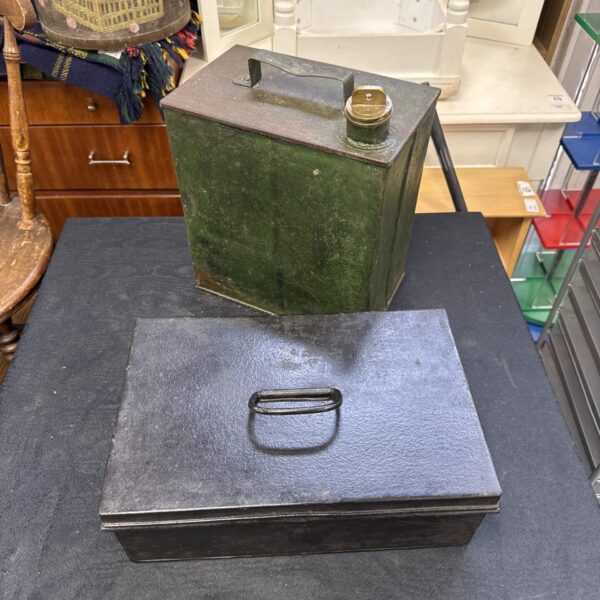 Green vintage metal strongbox with handle, antique collectible.