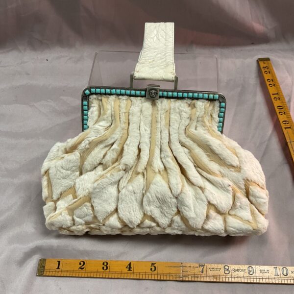 Vintage Versace evening bag with fur and turquoise accents.