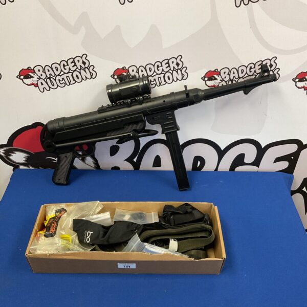 Tactical airsoft gun with accessories tray, ready for play.