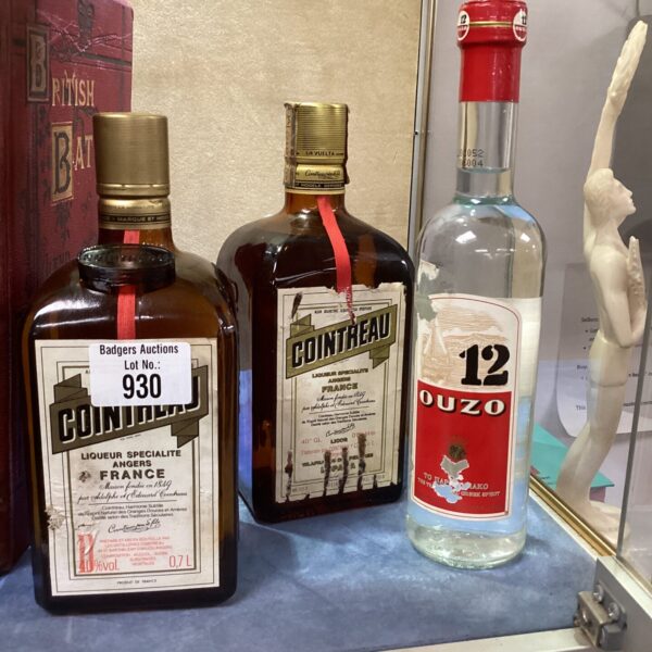 Vintage Cointreau and Ouzo bottles, collectible spirits, classic barware.