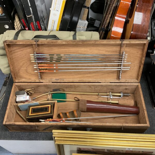 Vintage Merlin archery set with arrows in wooden case.