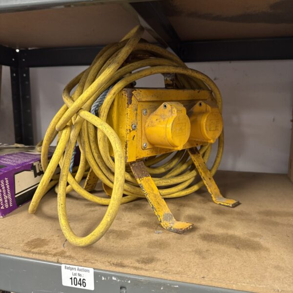 Four-gang extension lead with a yellow cable.