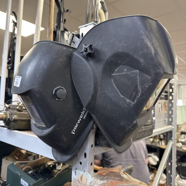 Used Parweld welding mask in a workshop setting.