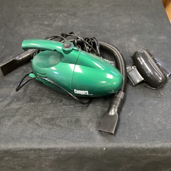 Vintage Coopers handheld vacuum cleaner for quick cleaning.