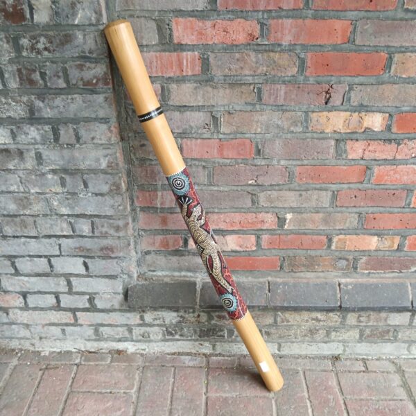 Hand-painted Aboriginal didgeridoo with intricate dot painting designs.