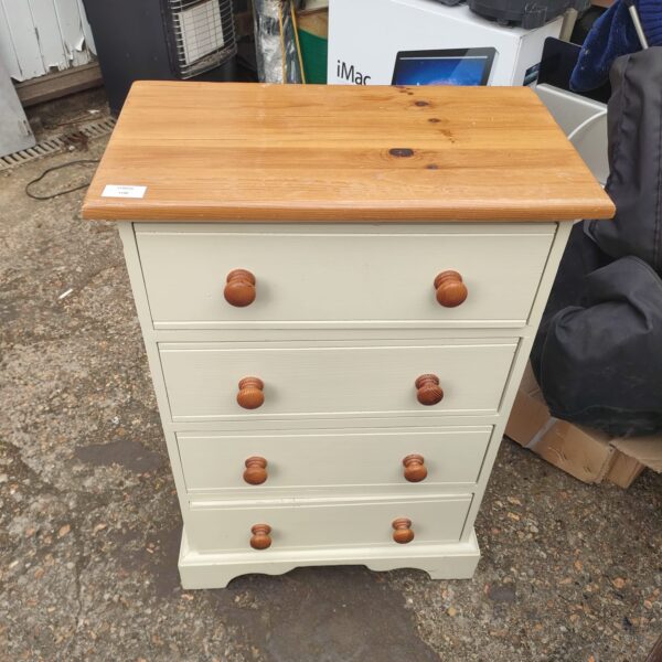 Vintage painted chest of drawers for bedroom storage.