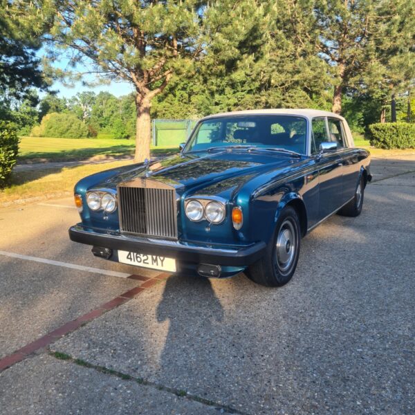 Front view of a blue 1979 Rolls Royce Silver Wraith II.