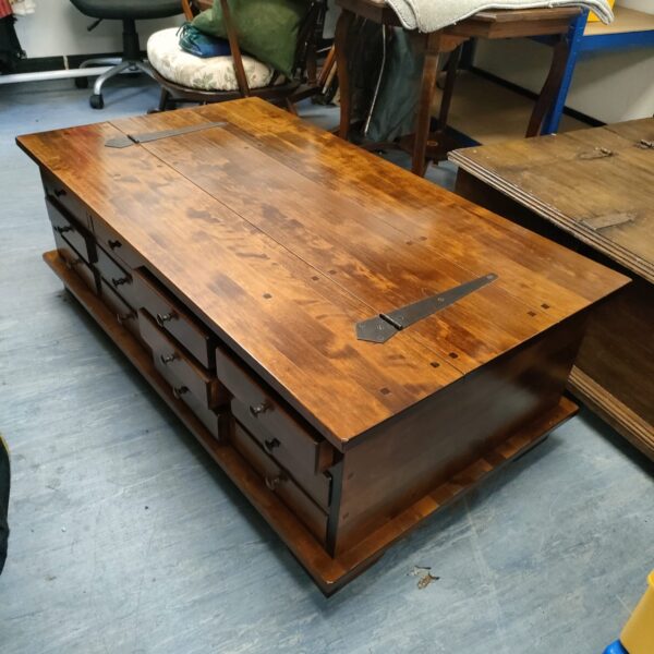 Vintage Laura Ashley wooden coffee table with drawers for living room storage.