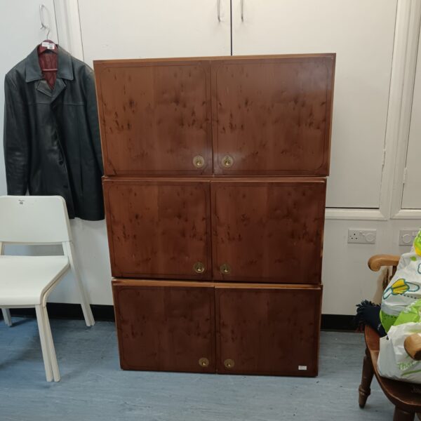 Vintage modular walnut cabinets with locking mechanisms for stylish storage.