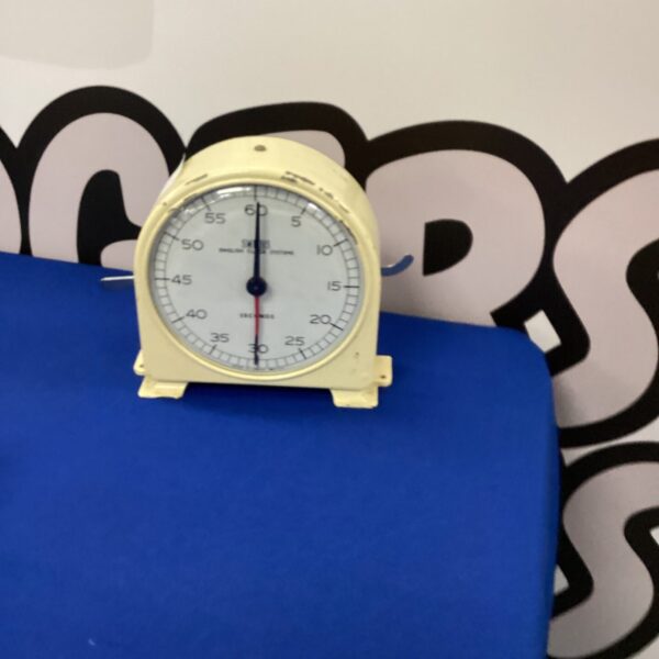 Vintage Smiths chess clock with two analogue dials.