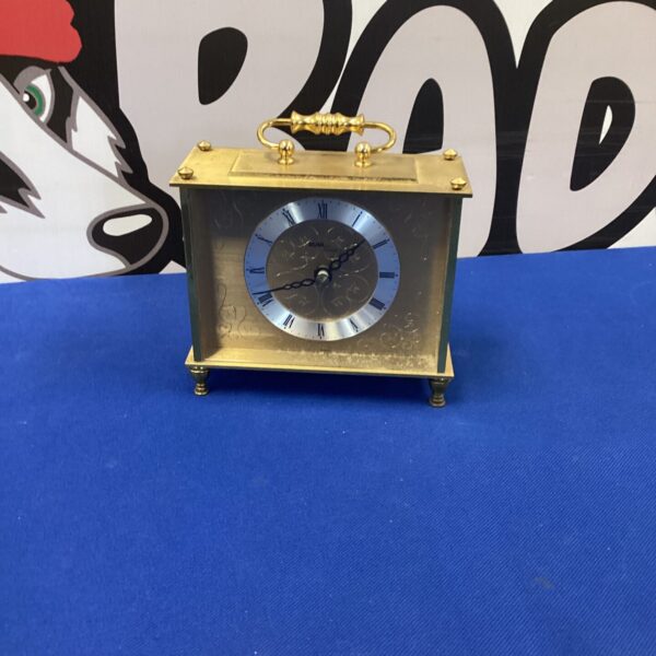 Vintage Avia metal mantle clock with Roman numerals.