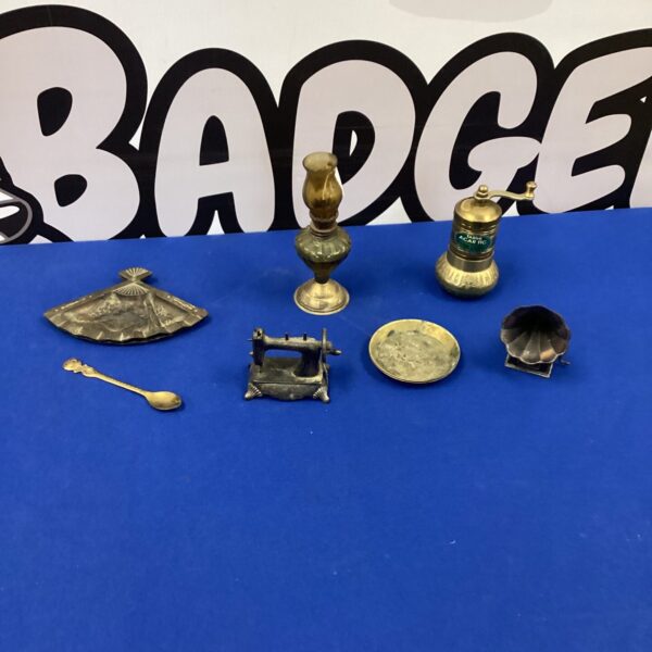 Vintage miniature brass collection of ornaments and tools.