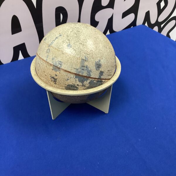 Vintage desktop globe with detailed world map.