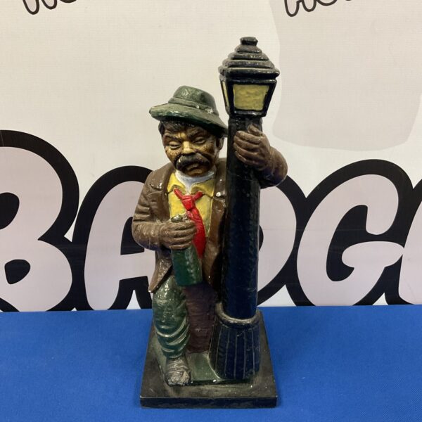 Vintage chalkware drunk man decanter, collectible barware.