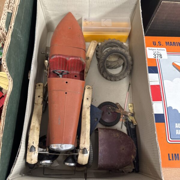 Red vintage tin plate car for restoration project.
