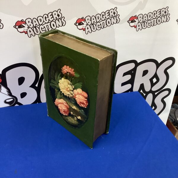 Vintage false book box with floral painting and hidden compartment.