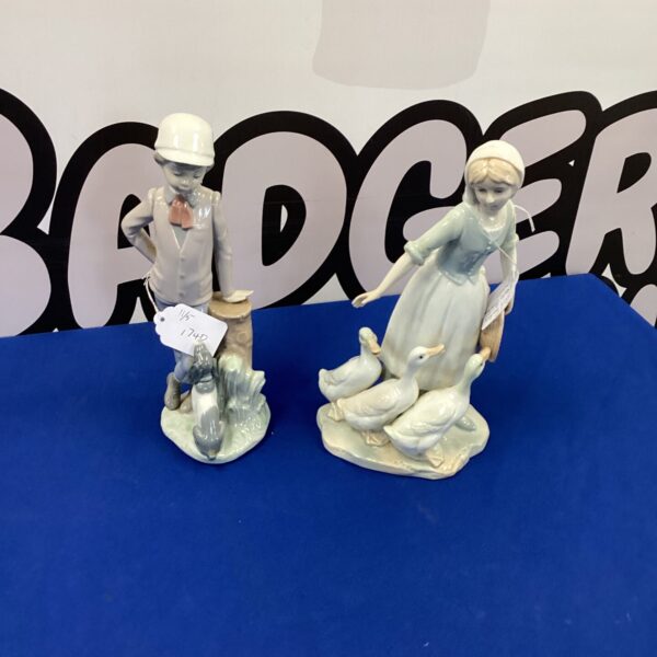 Two Nao porcelain figurines depicting charming scenes, collectible porcelain.