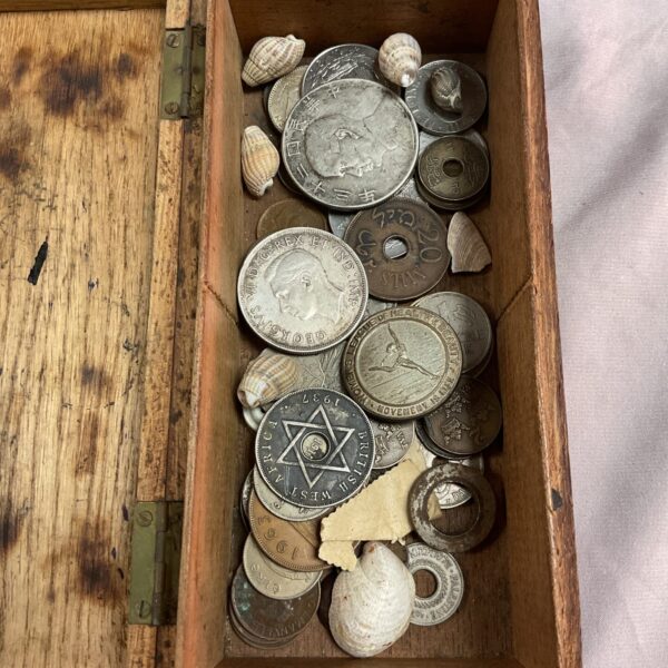 Overview of assorted vintage coins in a mixed lot.
